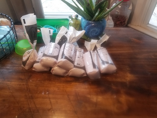 1lb bags of ground rabbit stacked on the table